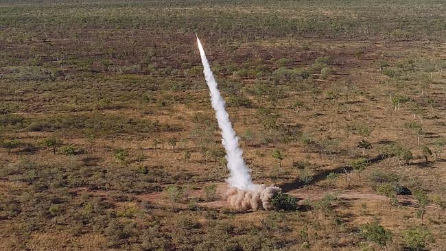 A United States Marine Corps M142 High Mobility Artillery Rocket System (HIMARS) fires a guided rocket against targets on Bradshaw Field Training Area in the Northern Territory.