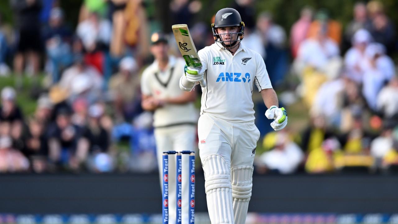 Tom Latham salutes after his half century during day two. (Photo by Kai Schwoerer/Getty Images)