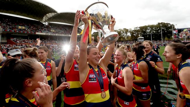 Adelaide players celebrate their 2019 AFLW Grand Final victory. How far can women’s sport progress in the next five years? Picture: James Elsby/AFL Photos