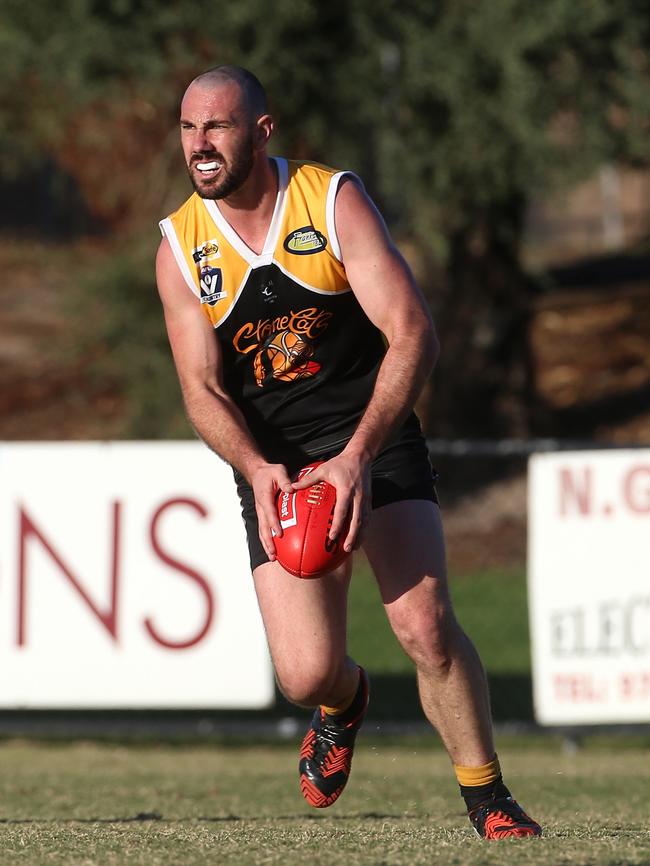 Star Frankston YCW defender Byron Barry looks for an option during Saturday’s game against Edi-Asp at John Coburn Oval. Picture: Hamish Blair