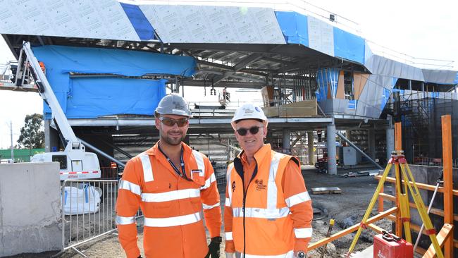 James Mercieca and Mike Kenealy in front of the new station, while it was still under construction. Picture: Lawrence Pinder