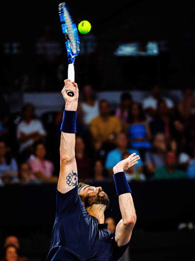 Jordan Thompson hits a return during his men's singles match against Grigor Dimitrov. Picture: Patrick Hamilton/AFP.