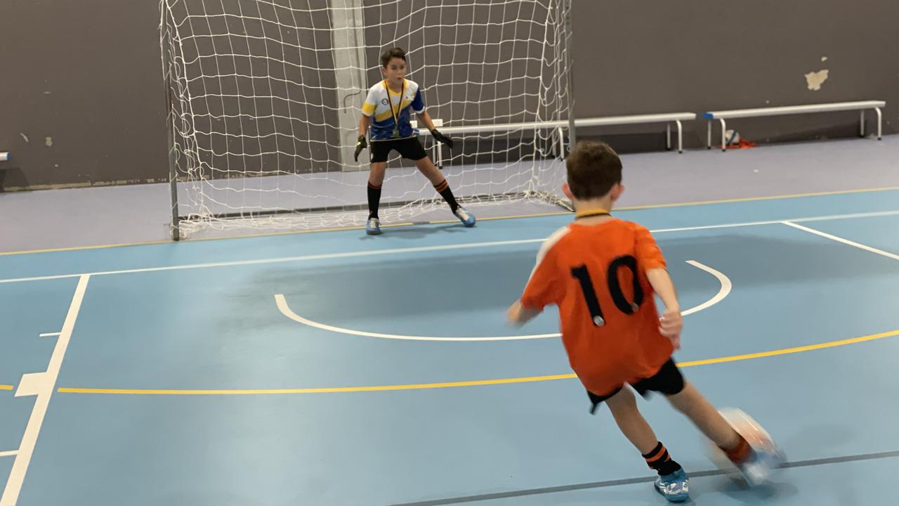 Number 10 Tarcisio Pritchard tries to sneak a penalty past teammate and goalkeeper Liam Manning, who the boys proudly proclaim is the best goalkeeper in the country. Picture: Max O'Driscoll