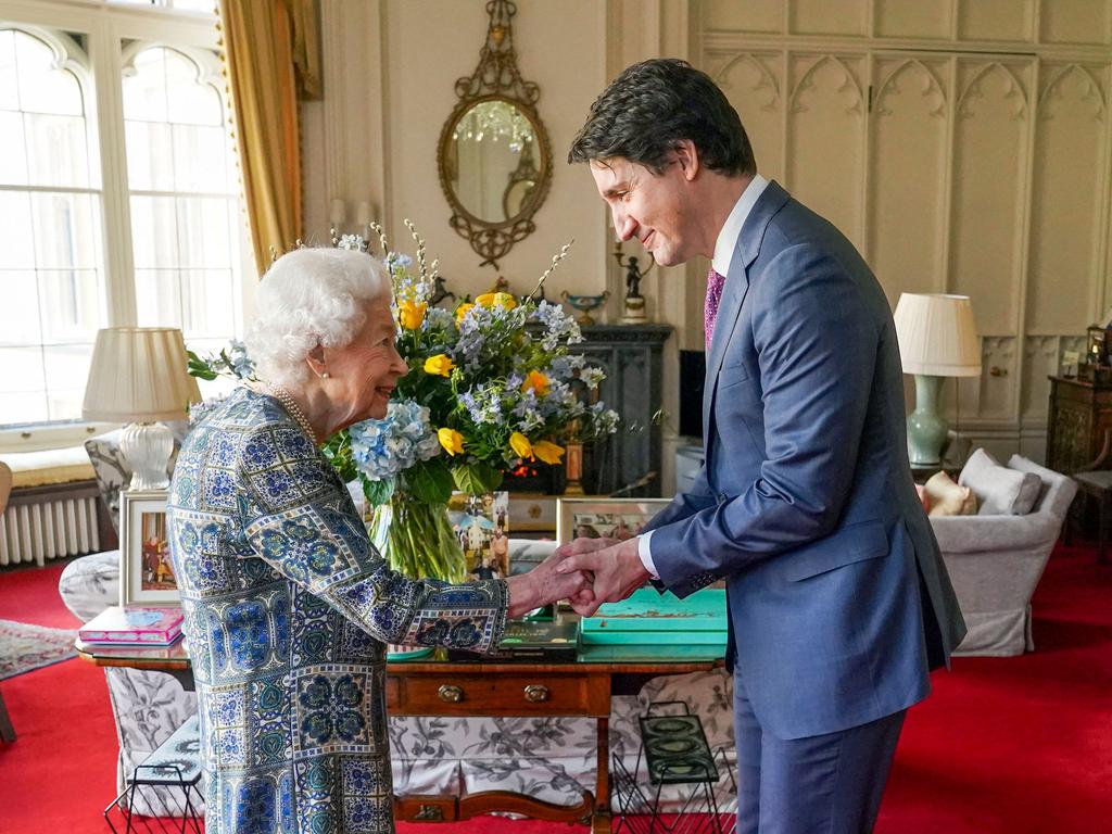 Britain's Queen Elizabeth II shakes hands with Canadian Prime Minister Justin Trudeau as they meet for an audience at the Windsor Castle. Picture: AFP.