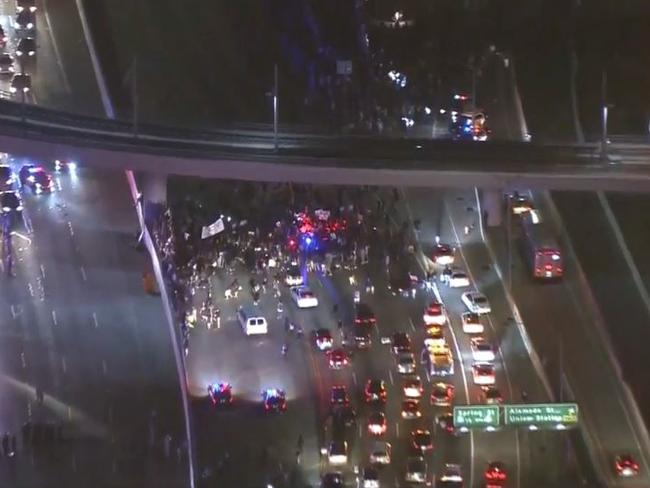 Anti-Donald Trump protesters shut down the 101 freeway in Los Angeles. Picture: CBS12.com