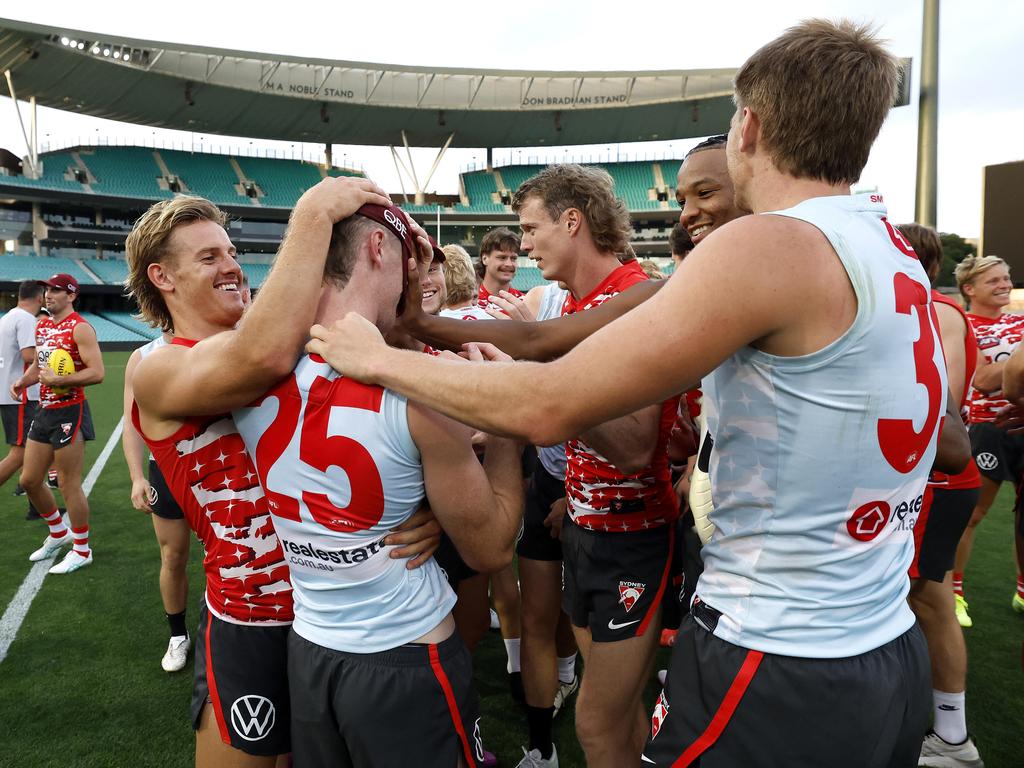 Ben Paton was swarmed by his teammates after being informed of his debut. Picture: Phil Hillyard