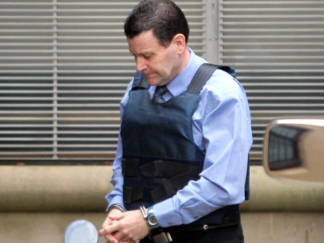 Mark Standen being led into King Street Court, Sydney, in 2011. Picture: Ross Schultz/Newspix