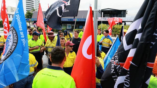 Union members from the ETU, QBuild, RoadTek and the CFMEU rally in front of Michael Healy's office. Picture: Brendan Radke