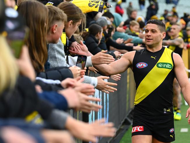 Dion Prestia of the Tigers high fives fans after a win last season. Picture: Quinn Rooney/Getty Images.