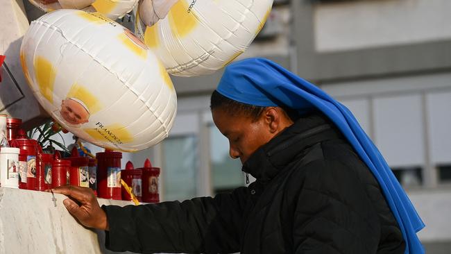 A nun prays at the holy rosary at the statue of John Paul II outside the Gemelli hospital where Pope Francis is hospitalized for pneumonia in Rome, on February 23, 2025. Picture: AFP.