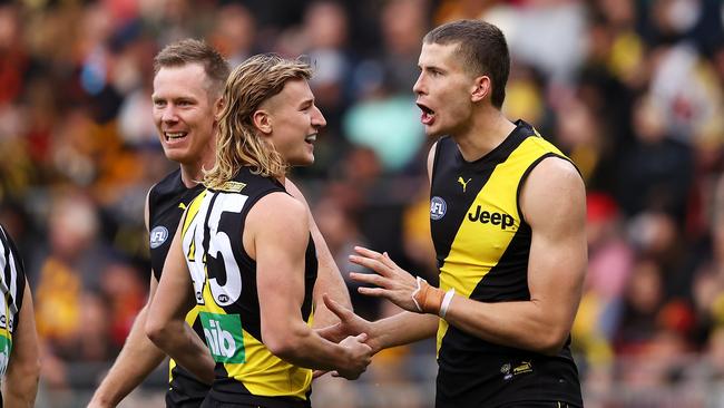 SYDNEY, AUSTRALIA – MAY 30: Callum Coleman-Jones of the Tigers celebrates with Jack Riewoldt and Hugo Ralphsmith of the Tigers after kicking a goal during the round 11 AFL match between the Richmond Tigers and the Adelaide Crows at GIANTS Stadium on May 30, 2021 in Sydney, Australia. (Photo by Mark Kolbe/AFL Photos/via Getty Images)