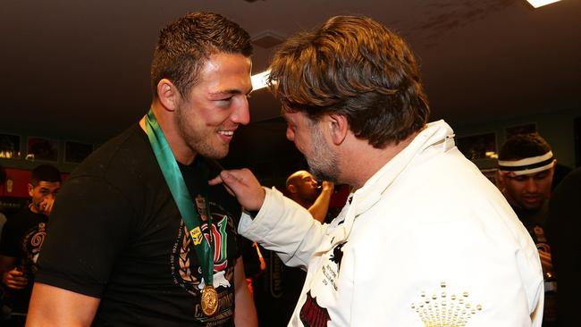 Burgess with Crowe in the South Sydney dressing rooms after the 2014 grand final win. Picture: Brett Costello