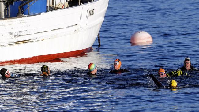 On group members’ birthdays, the swimmers paddle about while enjoying cake and some wine or champagne from a Thermos flask. Picture: KIM EISZELE