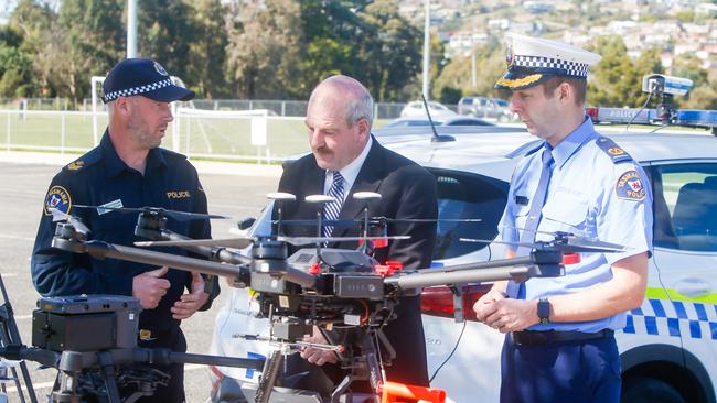 Senior sergeant Mark Forteath, police minister Mark Shelton and acting assistant commissioner Robert Blackwood unveil Tasmania Police's new drones. Picture: PATRICK GEE