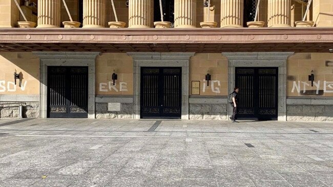 The word "SOVEREIGNTY" and the Aboriginal flag painted across City Hall. Picture: Supplied