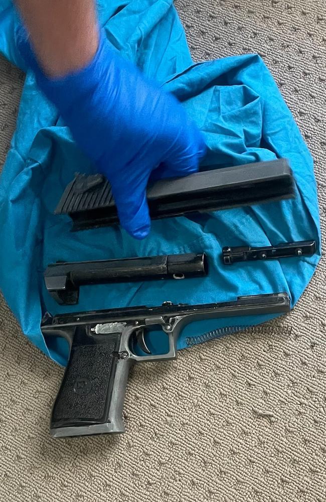 Police located and seized a semiautomatic pistol, OMCG clothing and cannabis utensils at the Redbank Plains address on March 8, 2022. Picture: QPS