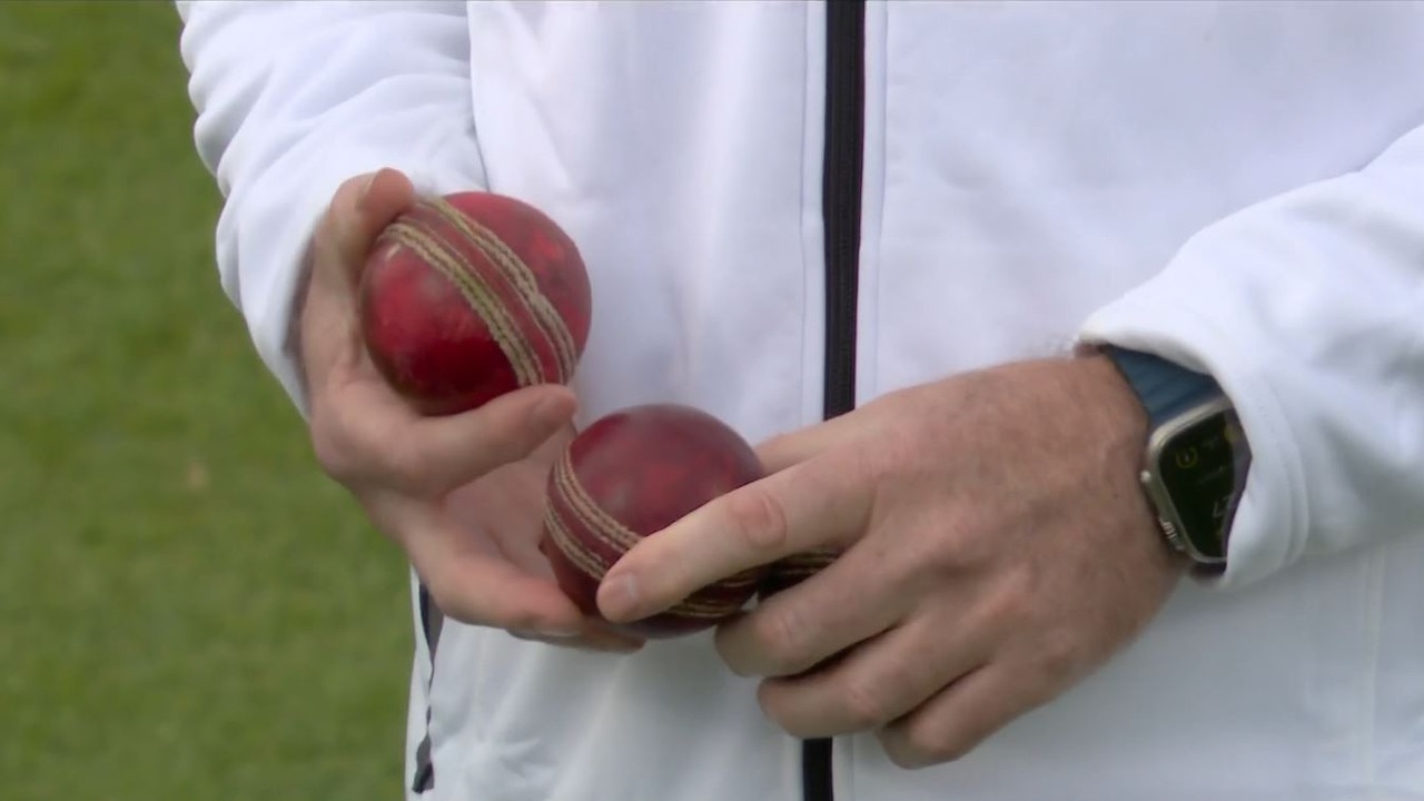 The old and new ball are inspected.