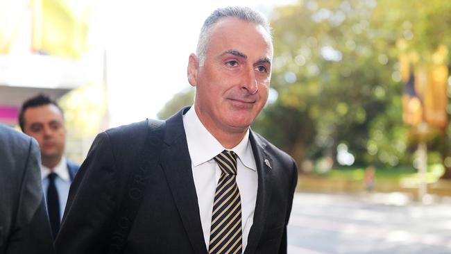 Liberal MP John Sidoti and his legal team arrive at his ICAC hearing in Sydney on Monday. Picture: Christian Gilles