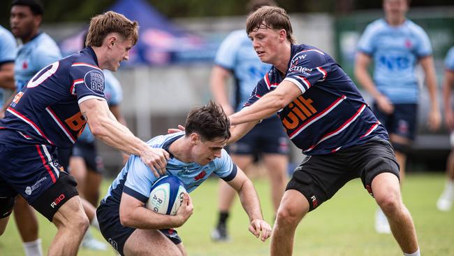 The Waratahs U18s playing Easts Colts in a trial training game recently.