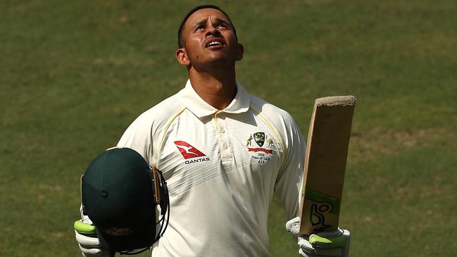 Usman Khawaja salutes after reaching his century in Dubai. Picture: Getty