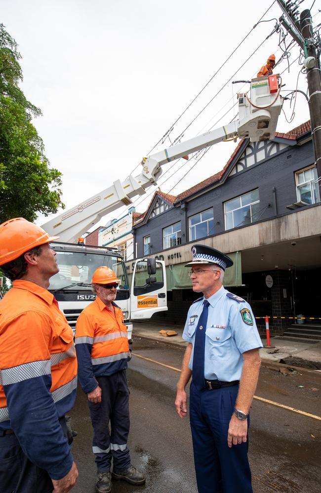 NSW Police Deputy Commissioner Mal Lanyon talking to the Andrew Witchard and Doug Campbell from Essential Energy. Picture: Danielle Smith