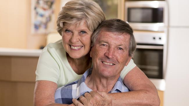 senior beautiful middle age couple around 70 years old smiling happy together at home kitchen looking sweet in lifetime husband and wife enjoying life and love concept; retirees, seniors generic