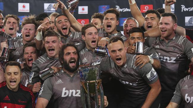 The Crusaders and captain Sam Whitelock celebrate their Super Rugby final victory over the Lions at Ellis Park.