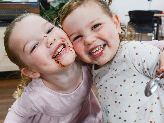 Ayla Story, 4, and her sister Sophia, 2, drinking a Teddycino and a Blueycino at Village Grounds cafe in Alberton, OCTOBER 4, 2022. Picture: Brenton Edwards