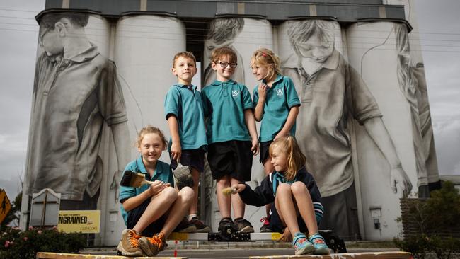 Ciara Johnson, Reef Gregor, Blake Thompson, Macey Jacobs and Kiarah Leske at the 30m high Coonalpyn silo mural. Picture: Matt Turner.