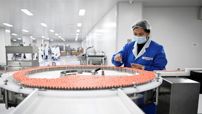 A staff member works during a media tour of a new factory built to produce a COVID-19 coronavirus vaccine at Sinovac, one of 11 Chinese companies approved to carry out clinical trials of potential coronavirus vaccines, in Beijing.