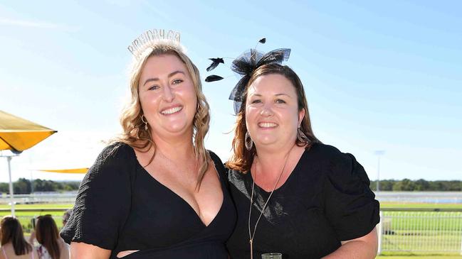 Kristy Craddock and Erin Slade at Coast to Coast Raceday, Corbould Park. Picture: Patrick Woods.