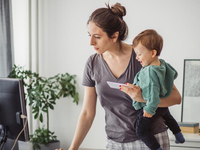 CHILD TECHNOLOGY -  Women working from home and playing with baby boy during pandemic isolation Picture: Istock