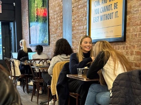 This photo of Margot Robbie having a coffee with author Sarah J Maas has sent fans into a frenzy. Picture: Instagram