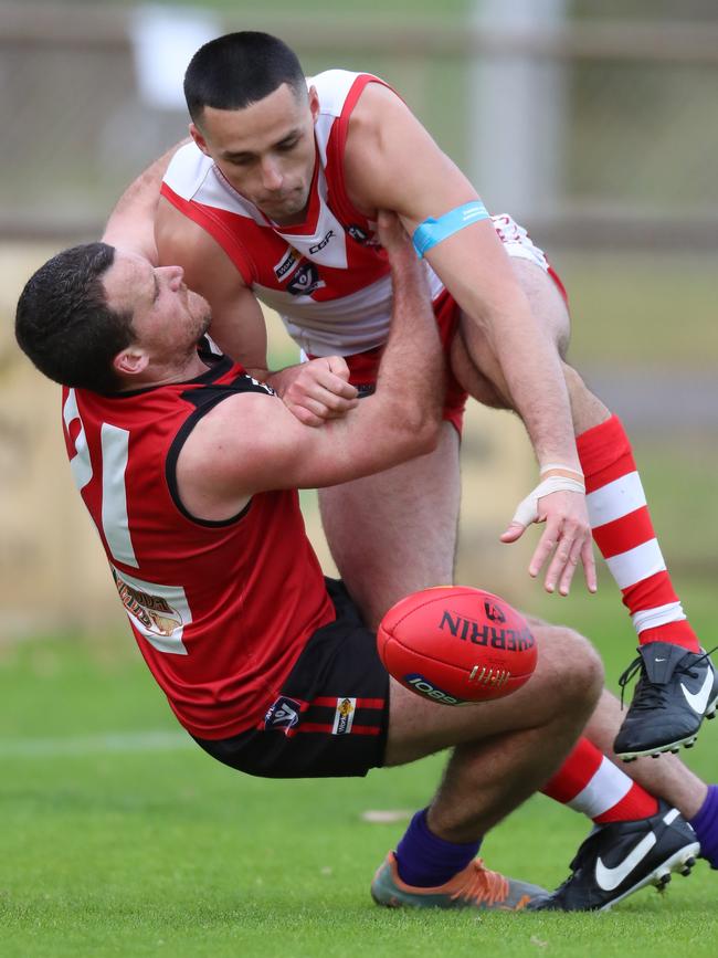 Ararat first-gamer Jarrod Korewha is tackled by Stawell’s Mitch Thorpe. Pictures: Yuri Kouzmin