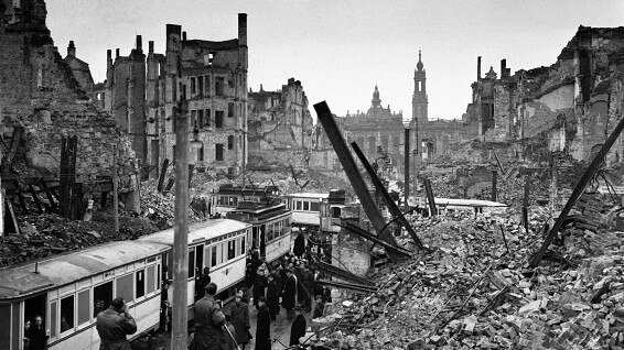 Dresden citizens in the Soviet sector of Germany attempt to get on trams amid the ruins and chaos. Picture: Getty