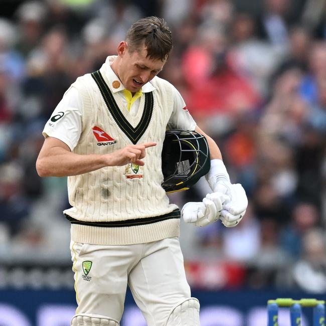 Australia's Marnus Labuschagne checks his hand after mis-hitting a shot off England's Mark Wood. (Photo by Oli SCARFF / AFP)