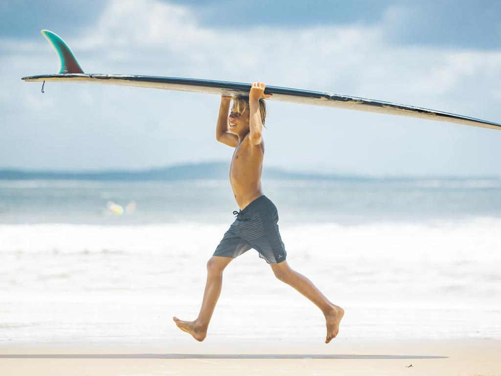 Ryder Worthington 12, getting ready for a surf at Noosa. Picture: Lachie Millard
