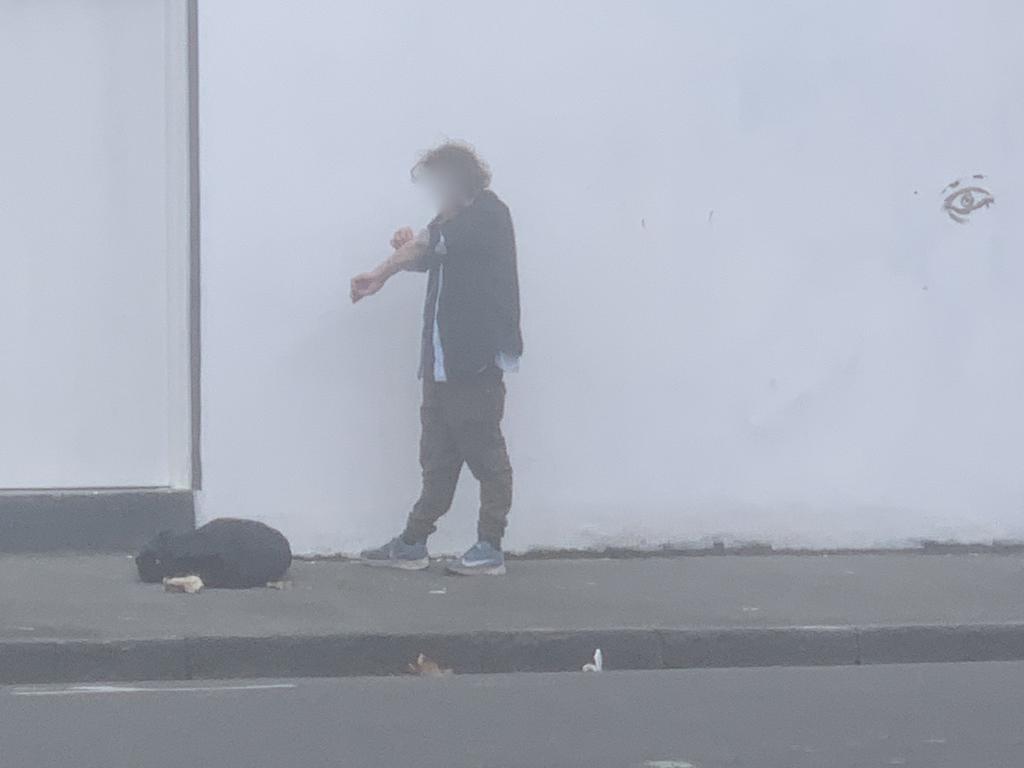 A man injects on the street near the injecting room in North Richmond. Picture: Supplied