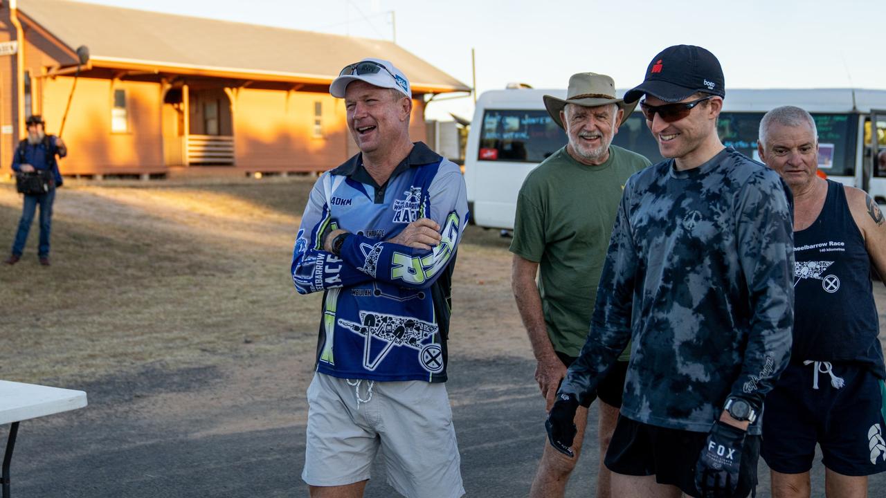 Kevin Davies (left) with Great Wheelbarrow Race competitors. Picture: Supplied