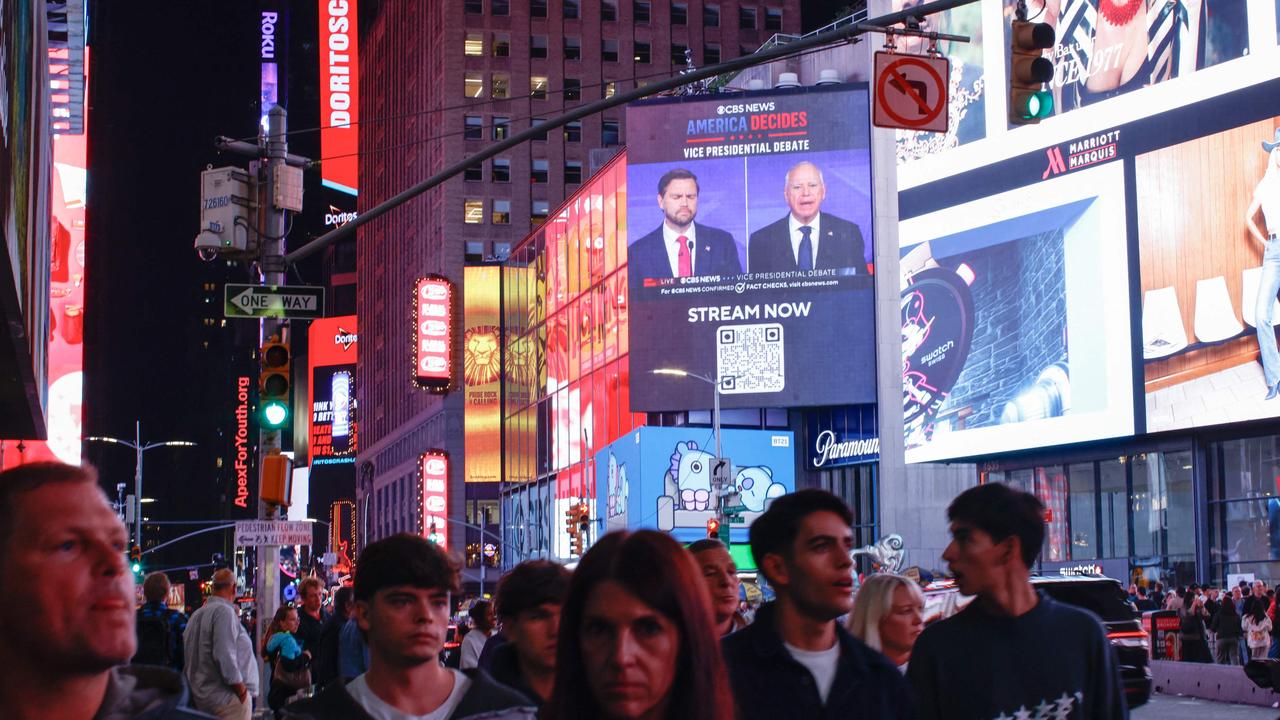 A screen displays the CBS vice presidential debate in Times Square in New York on October 1, 2024. Picture: KENA BETANCUR / AFP