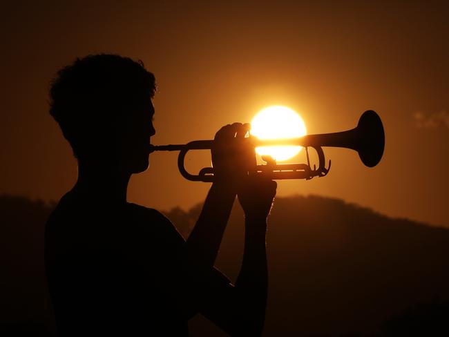 Lindisfarne year 10 student Monty Lush plays the Last Post as the sun sets over the Tweed Coast for ANZAC day.Photo: Scott Powick Newscorp