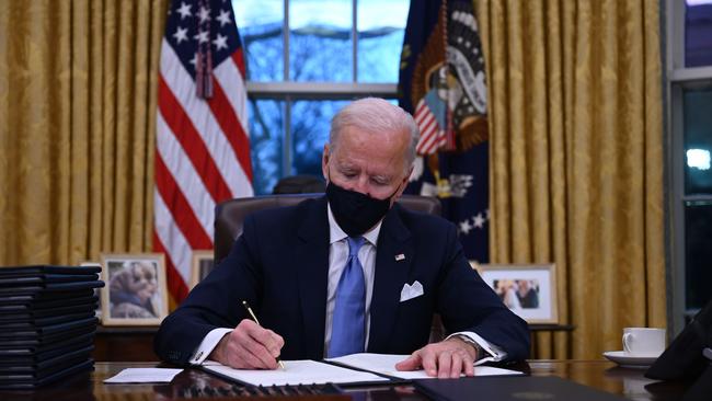 US President Joe Biden signed a raft of executive orders to launch his administration, including a decision to rejoin the Paris climate accord. Picture: AFP