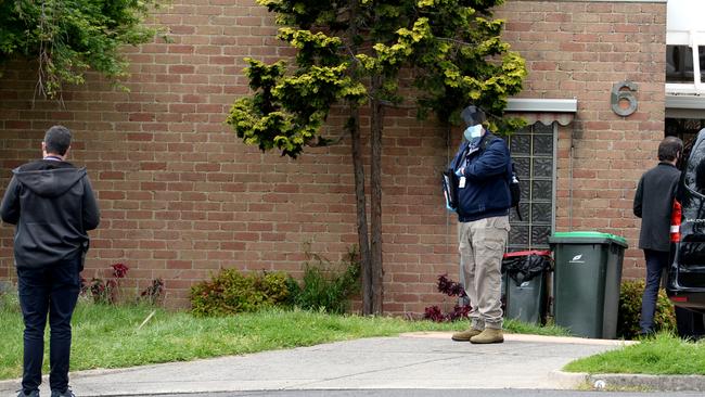 Victoria Police and AFP at a property. Picture: Andrew Henshaw