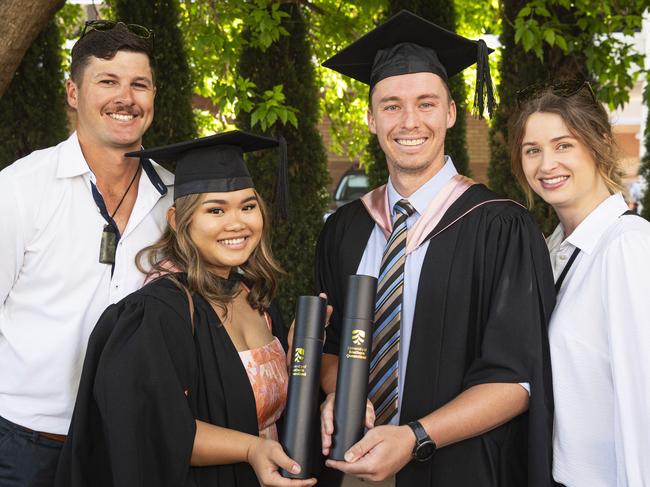 Bachelor of Education (Secondary) graduate Blazel Busiko and Master of Education (Guidance and Counselling) graduate Cody Grubb celebrate with Harry Busiko and Zoe Grubb at a UniSQ graduation ceremony at The Empire, Tuesday, October 29, 2024. Picture: Kevin Farmer