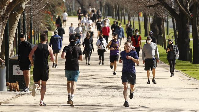 People gathering at The Tan running track in South Yarra. Picture: NCA NewsWire