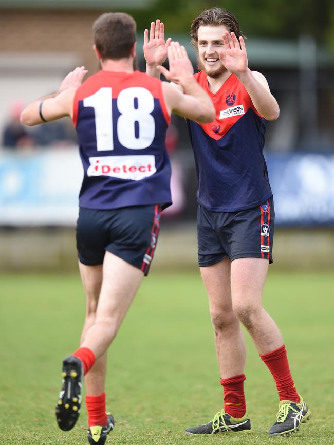 Well done, mate: Mt Eliza's Daniel Gormley (left) congratulates teammate Jordan Capkin after his goal. Picture: Jason Sammon.