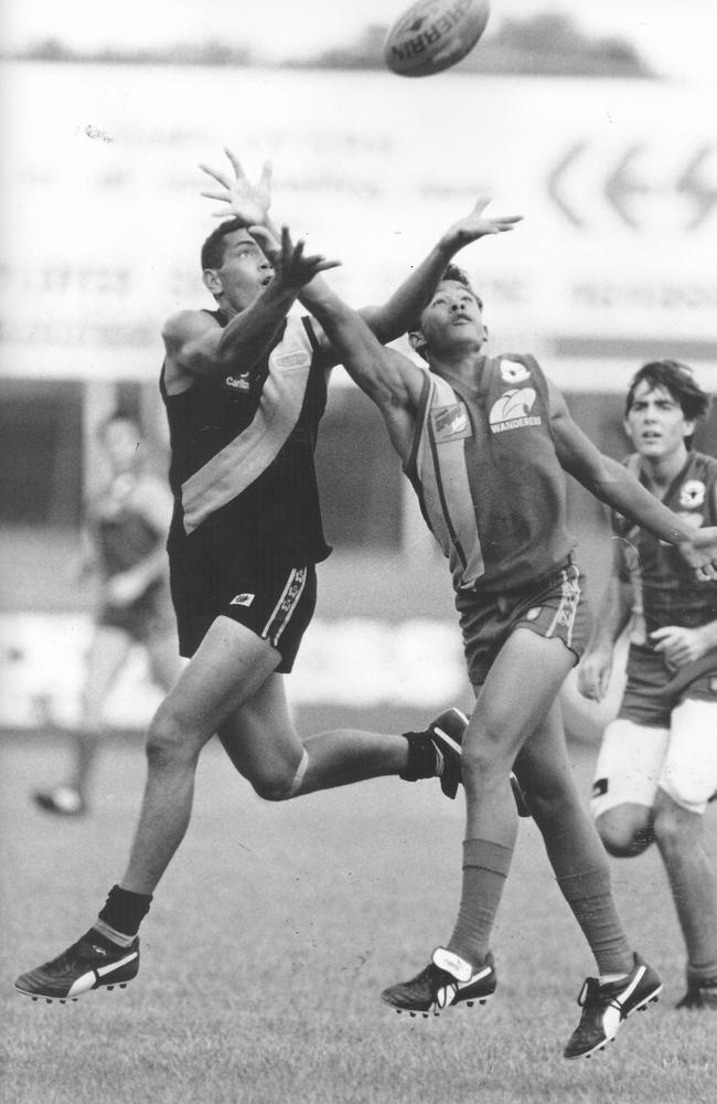 Nightcliff's Norm Murphy (left) and Wanderers Dean Dempsey vie for the ball during an NTFL match held at Gardens Oval. Circa: 10/1995.