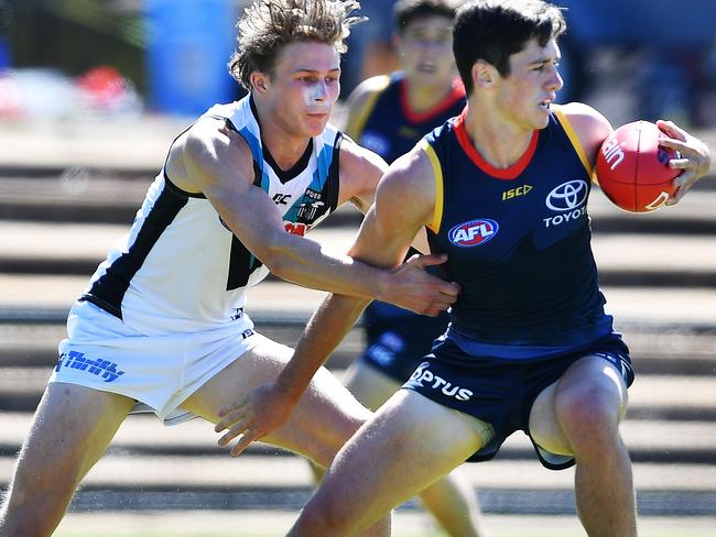 Xavier Duursma of Port competes with Chayse Jones of the Crows during the Adelaide Crows verse Port Adelaide Under 23 trial at Thebarton Oval Saturday February 23,2019.(Image AAP/Mark Brake)