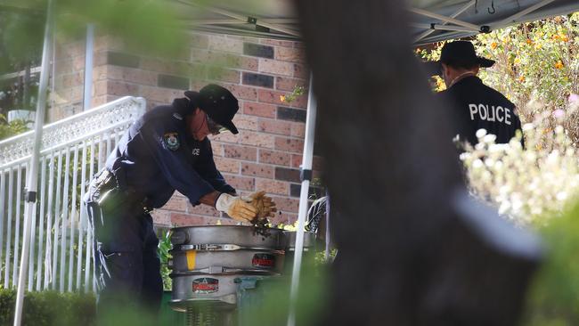 13/09/2018: DAY 2 - NSW Police from the NSW homicide sort through dirt from near the pool area as part of forensic search at the home of Lynette Joy Dawson's former home at Bayview. Hollie Adams/The Australian