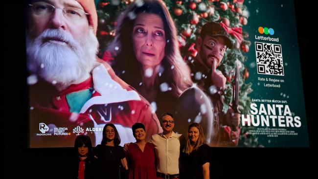 Frankie, Kayla Mildren, Donna Mildren, Richard Jamze and Gabrielle at the premiere of their movie Santa Hunters at the Palace Barracks Cinema, December 2024. Picture: Yuri Nezovic